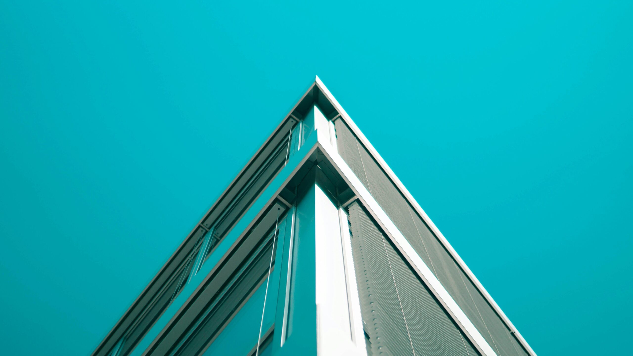 sfr property management gray-blue condo building roof snapshot on blue sky