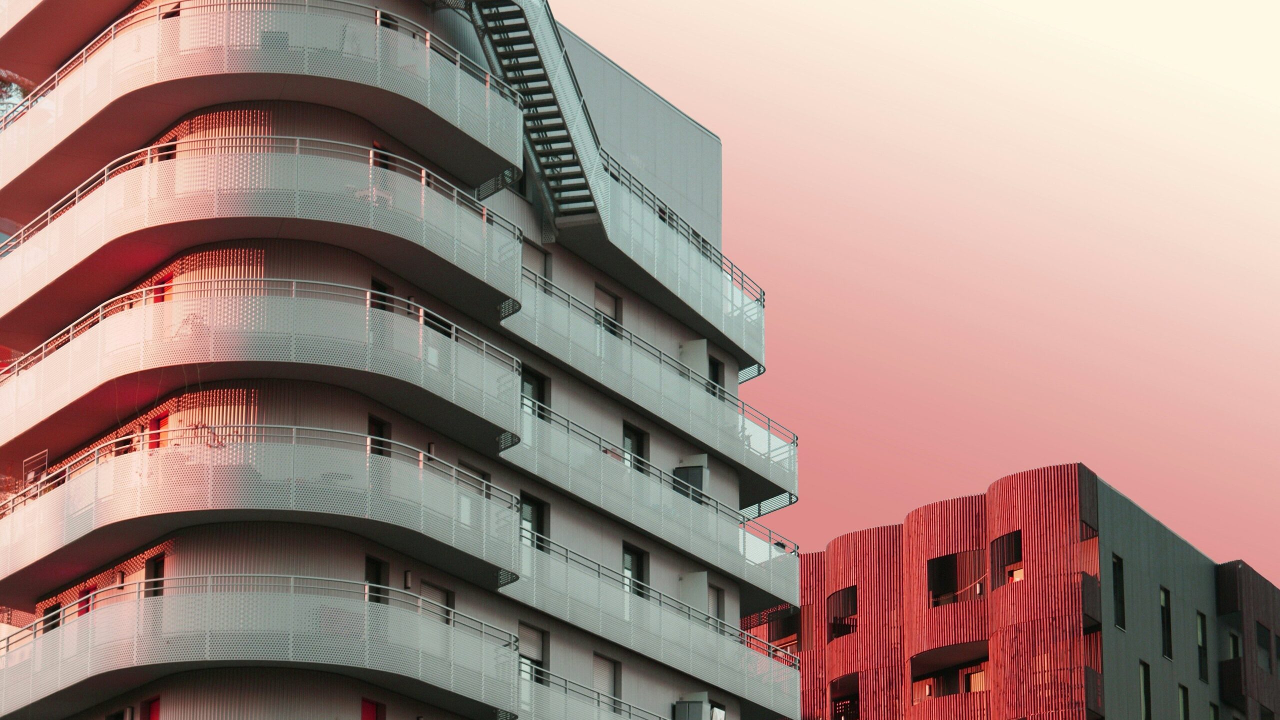 sfr property management condo buildings pink hue background